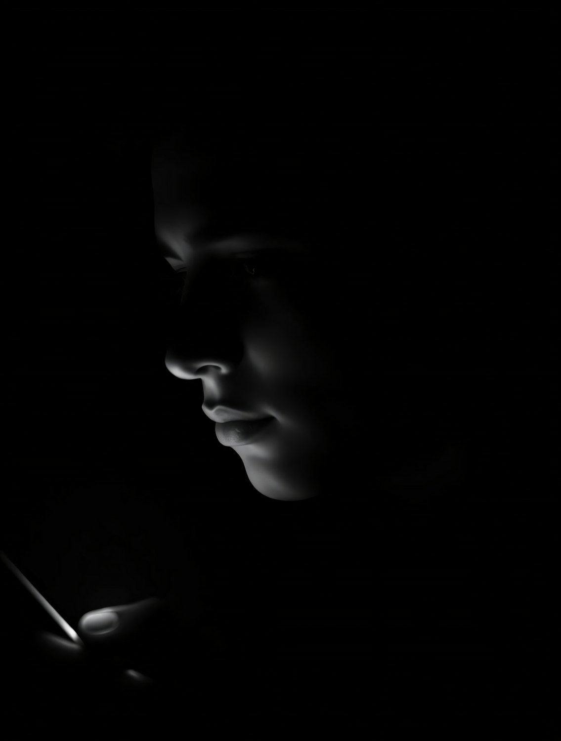 A person sitting with a laptop open for research, but their eyes are drawn to their smartphone displaying social media feeds, symbolizing common digital distractions.