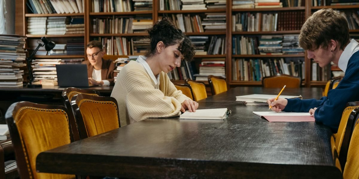A student deeply engrossed in their studies, exhibiting strong concentration.