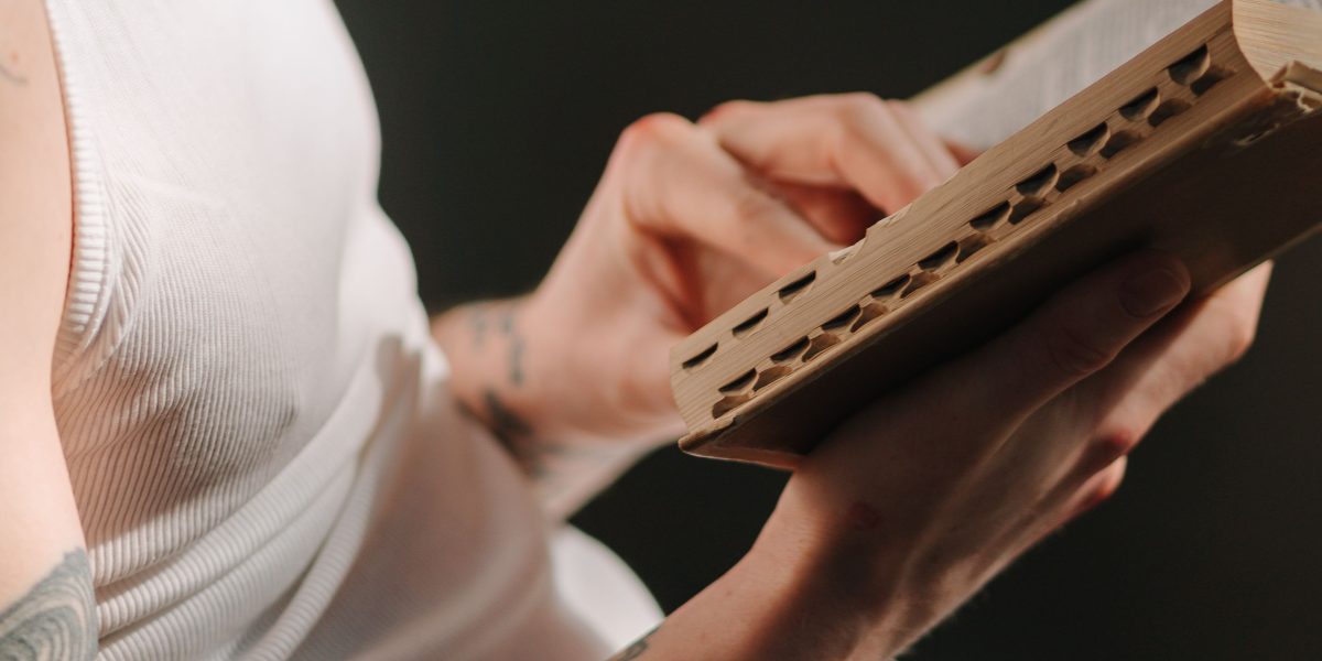 A person deeply engrossed in a book, demonstrating focused attention in a calm setting.