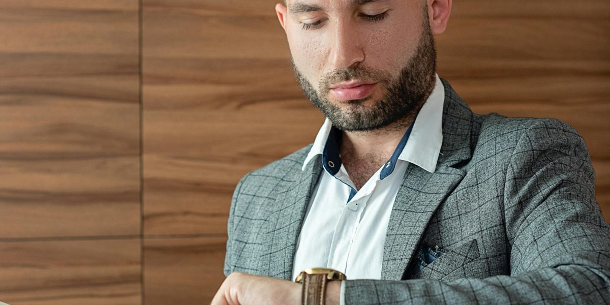 A professional actively planning their day, using a physical or digital calendar to block out focus periods.
