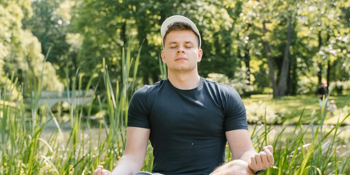 A person engaging in mindfulness or meditation, demonstrating a method for mental reset and attention control.