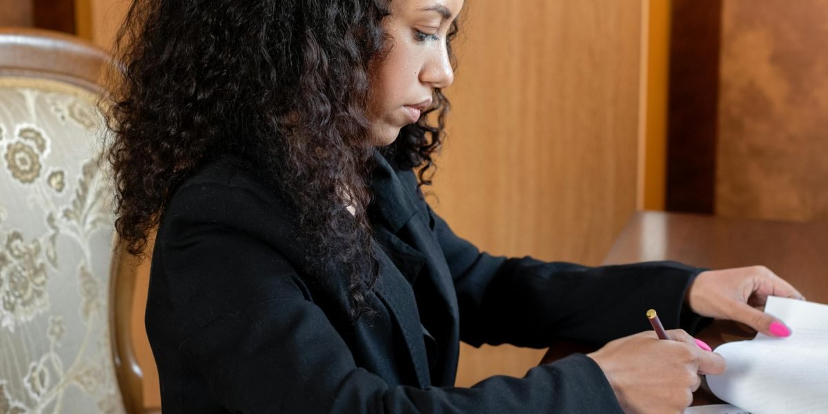 A professional carefully reviewing documents or a digital file, ensuring high-quality formatting.
