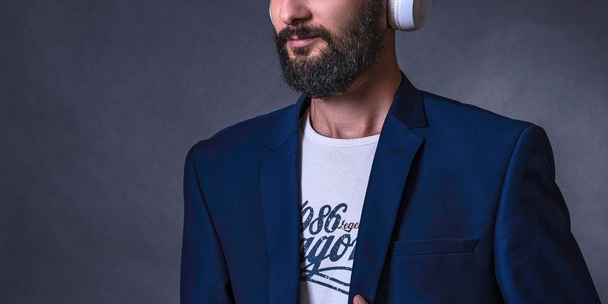An individual listening to an audiobook, demonstrating focused engagement and the cognitive benefits of sustained attention.