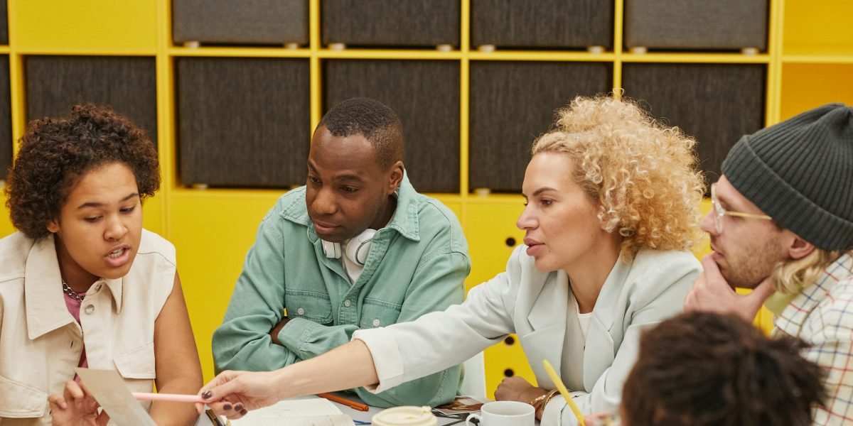 Individuals working together on a common objective, symbolizing the power of community challenges in building consistent habits.