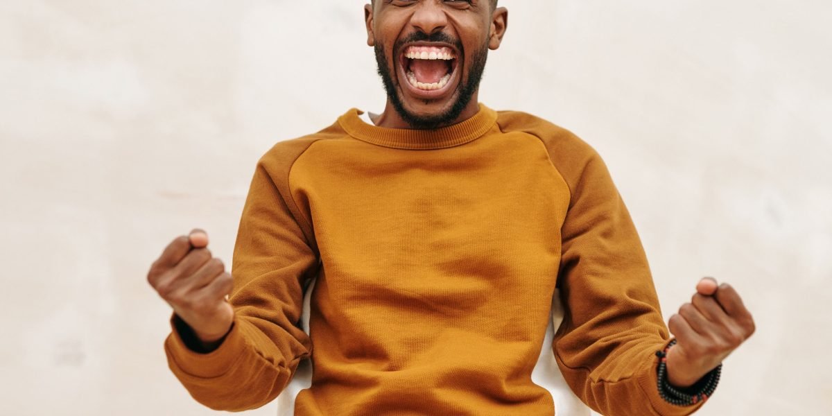 A person celebrating a small personal achievement, reflecting the motivational aspect of gamification.