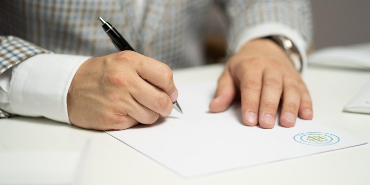 A person carefully organizing papers, symbolizing the meticulous preparation and attention to detail needed for EPUB files.