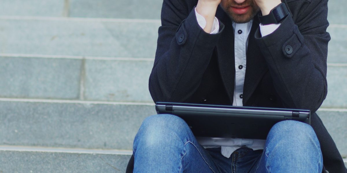 A person experiencing information overload from constant digital pings, struggling to maintain focus.