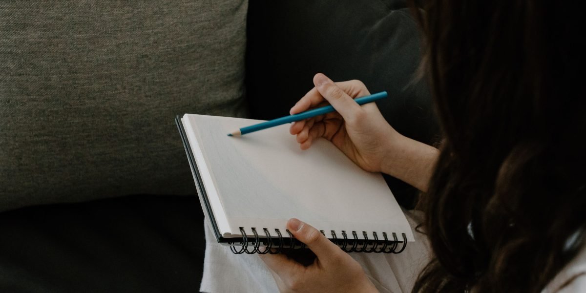 A student actively interacts with their study materials, perhaps annotating or taking notes, demonstrating deep engagement.