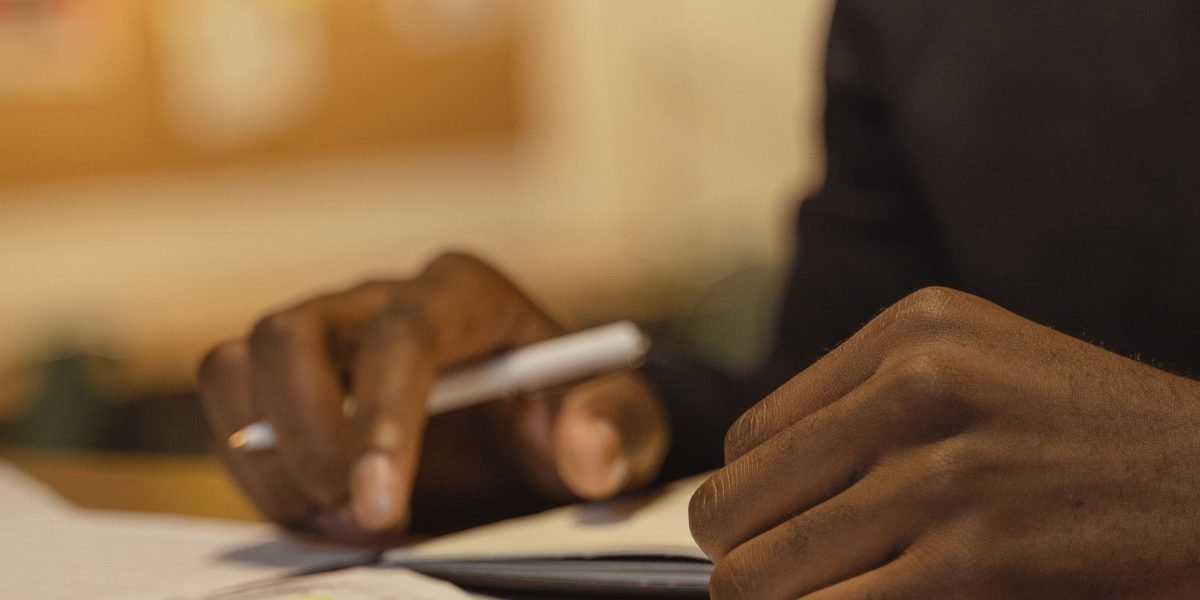 An individual thoughtfully planning their study schedule, combining different learning techniques for optimal results.