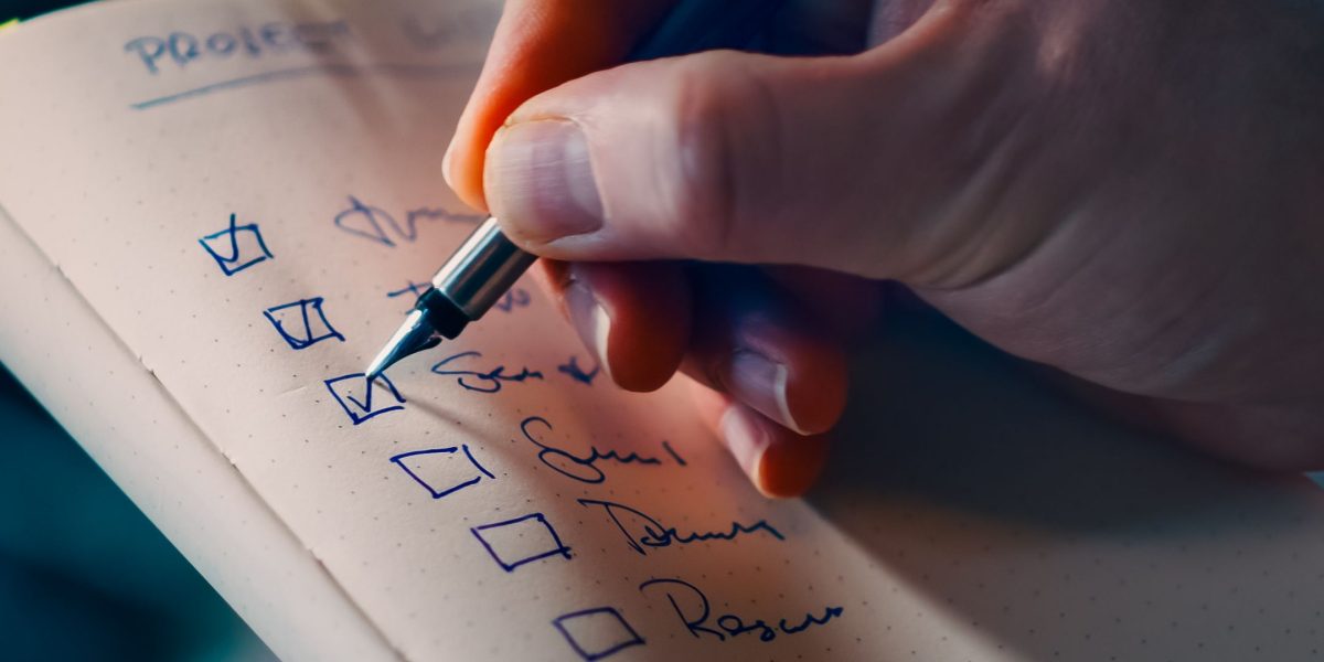 A person tracking their reading and concentration progress in a notebook or journal.