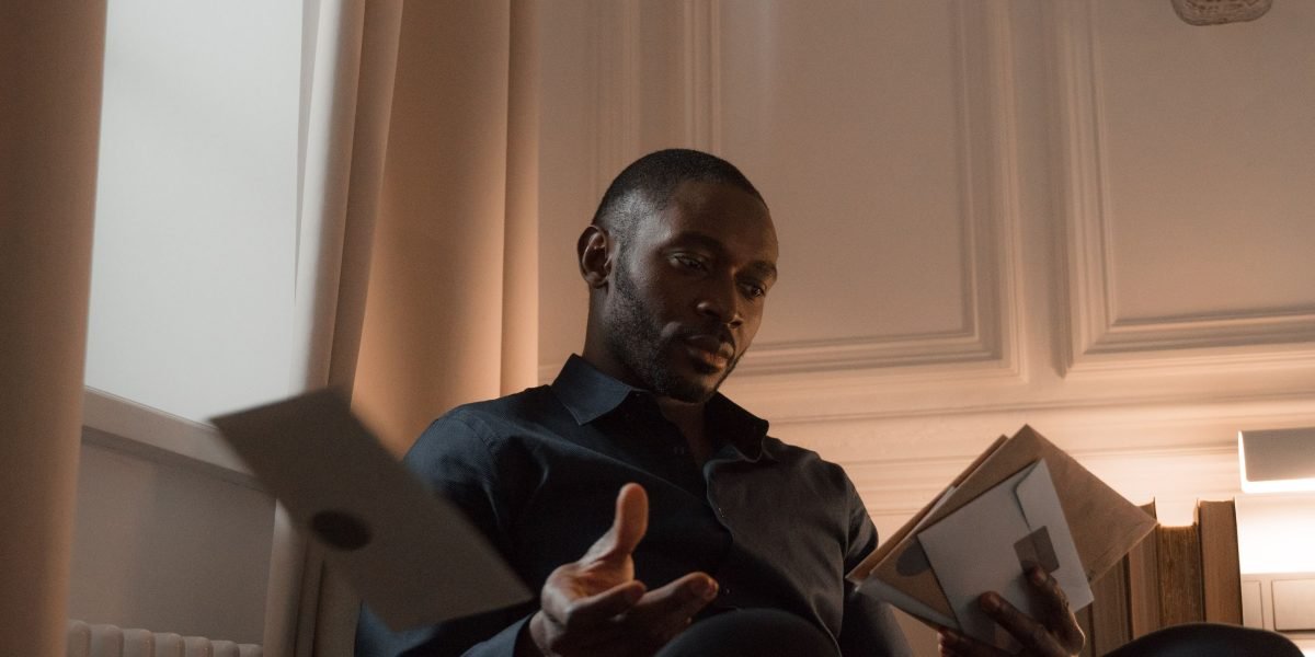 A person engaged in deep reading, embodying the journey to improved concentration and mental clarity.