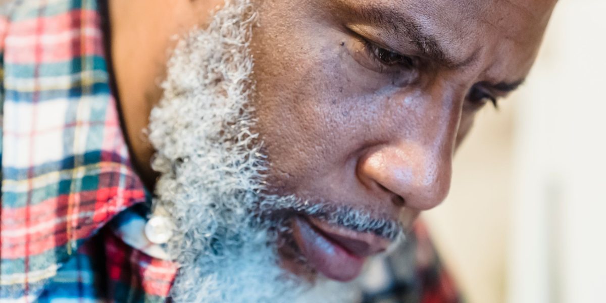 A person engaged in deep thought or concentrated work, demonstrating focused attention.