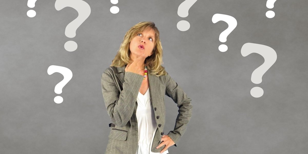 A person takes a deliberate pause from their activity, engaging System 2 thinking to reflect on an urge or thought before reacting.