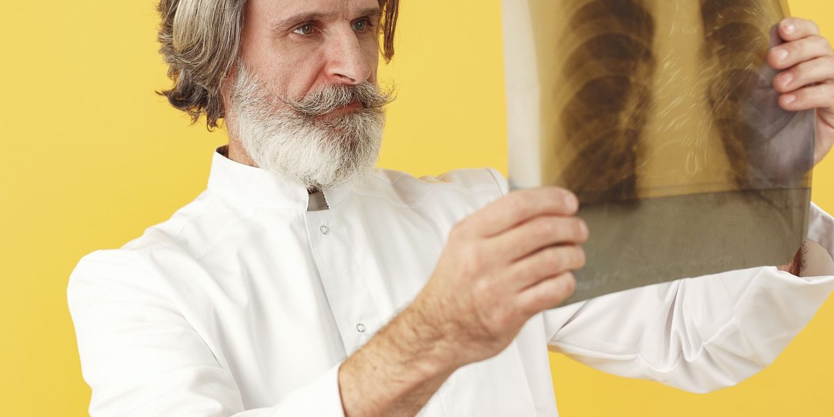 A doctor intently examining brain CT scan images on a monitor, looking for normal changes or potential issues affecting cognitive health.