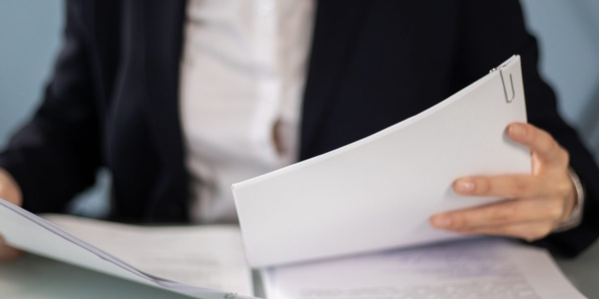 An author meticulously reviews their manuscript, ensuring quality and avoiding common pitfalls.