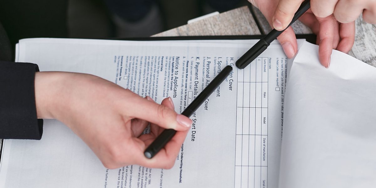 An individual carefully reviewing privacy policies or terms and conditions, showing concern for their personal data.