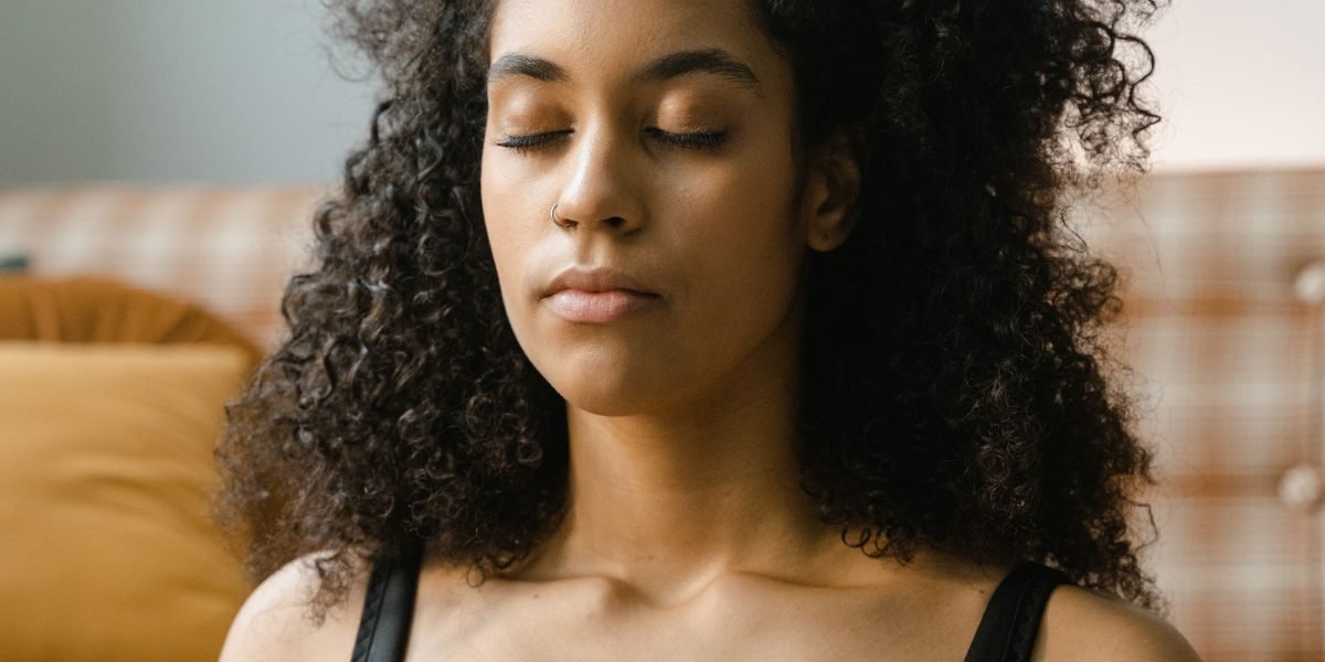 Someone engaging in a meditation practice, embodying the calmness and focus achieved through these techniques.