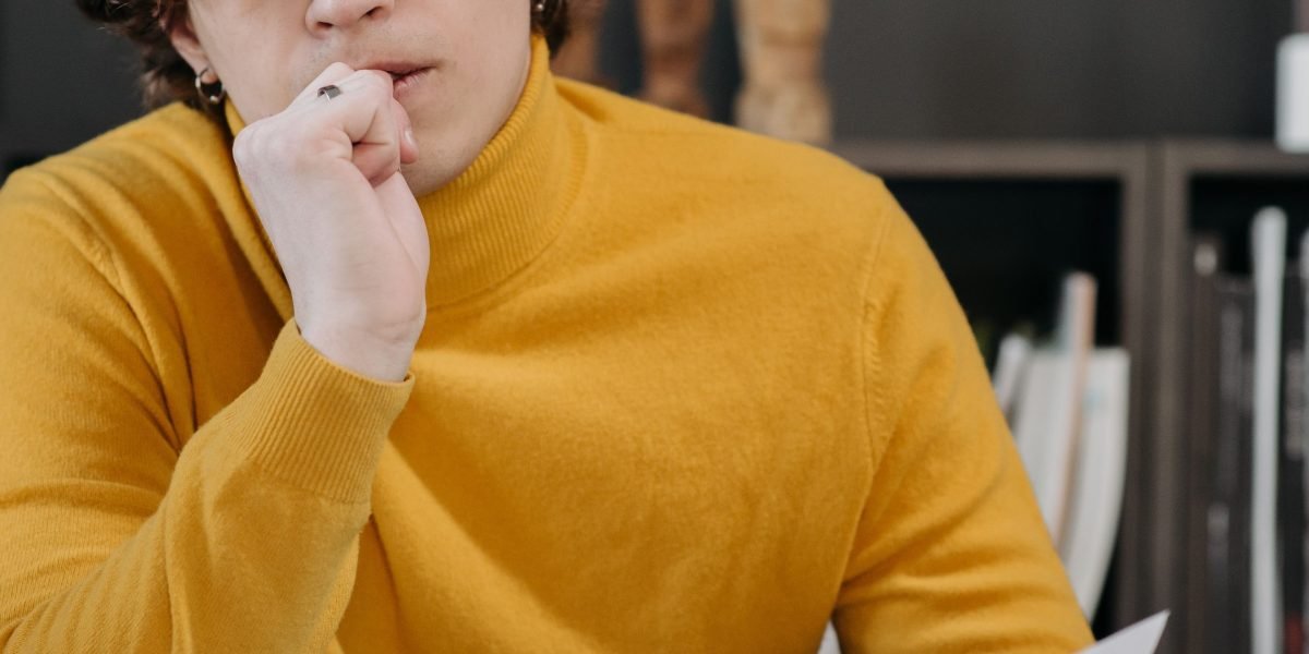 A person in a state of deep concentration, effectively managing their work.